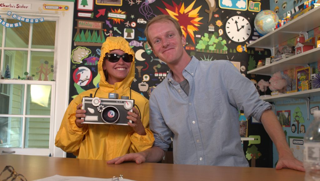 CHICAGO, ILL.- (Left to Right) Kirby roleplays as a storm chaser as Charlie reports at "HQ". (Photo credit: National Geographic Channels/Jill Littman)